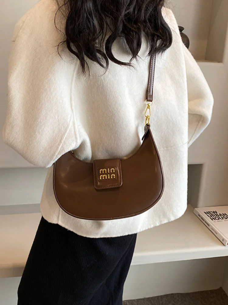 Bolso de moda de diseñador de lujo para mujer, nuevo bolso de media luna con textura de nicho, bandolera de hombro simple para ir al trabajo