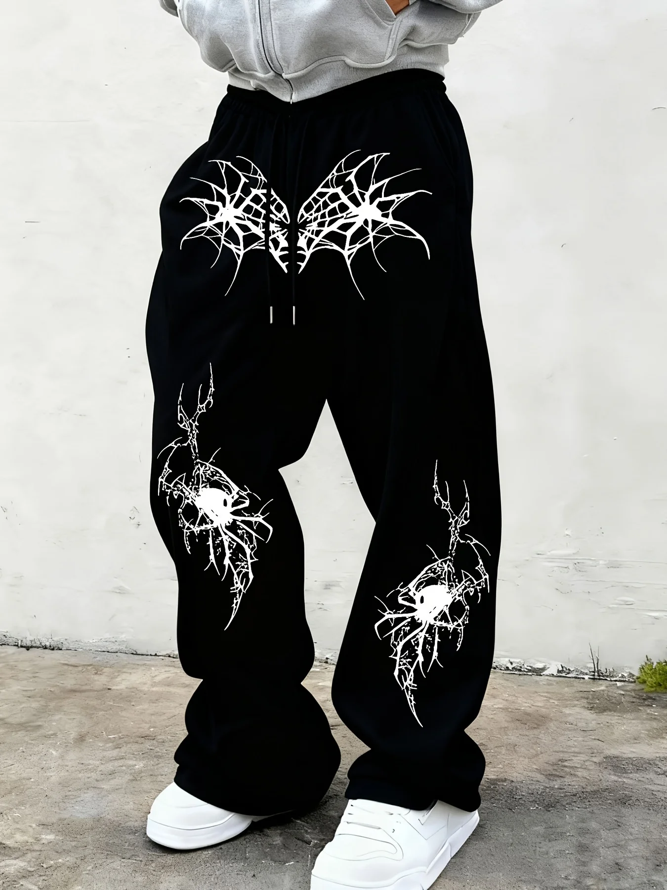 

Men's black wide leg jogging pants with spider web print and skull spider pattern on the knees, gothic street pants sweatpants