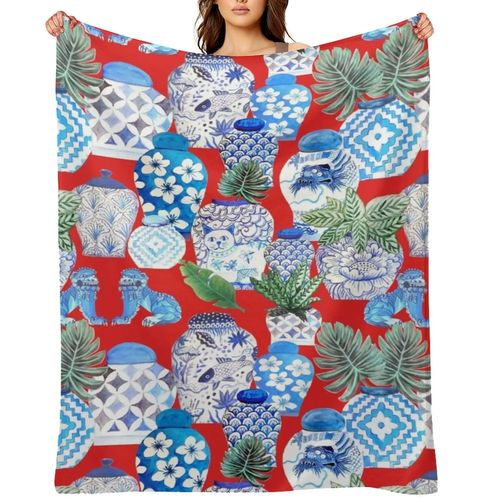 

ginger jars in blue and white porcelainand foo dogs on red with palms Throw Blanket Plaid on the sofa Vintage Blankets