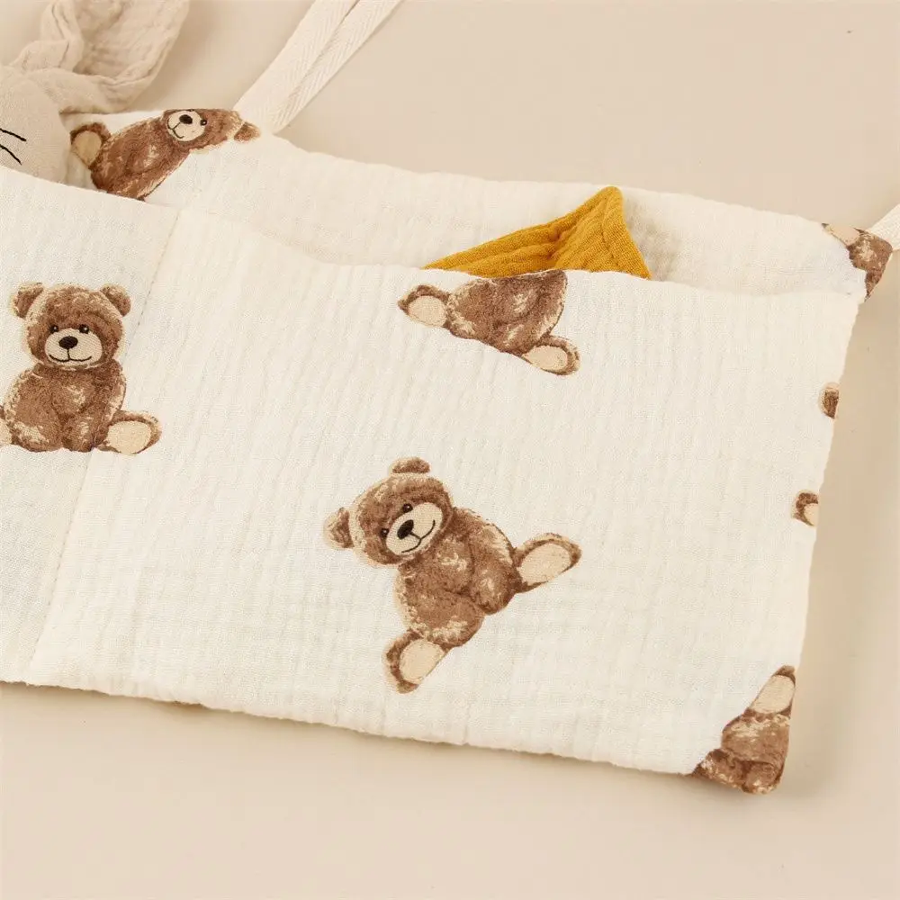 A printed multi - functional hanging diaper storage bag, an organizer for diapers and accessories in the nursery, a diaper stora