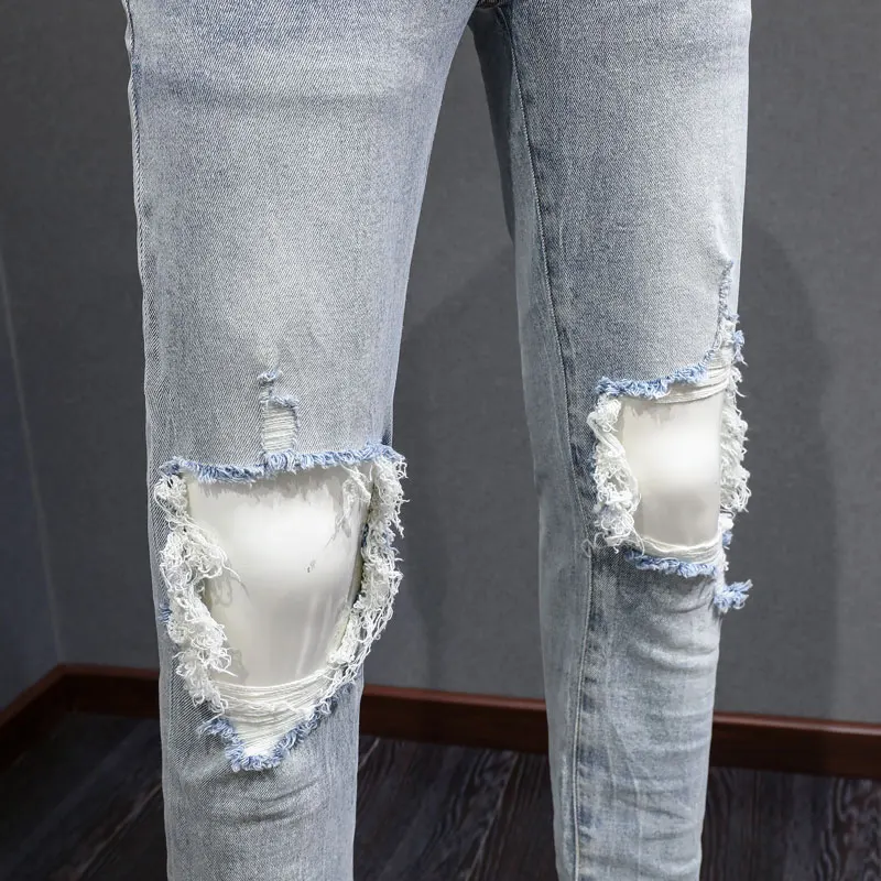 Fashionable new men's light blue jeans, washed, nostalgic, perforated, white patch, elastic, slim fit, painted jeans, hip-hop br