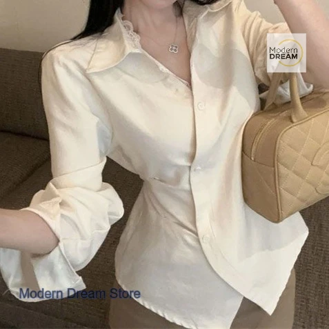 Camicia di nicchia senso design in stile francese da donna primavera e autunno nuova moda top a maniche lunghe sottile con cintura irregolare