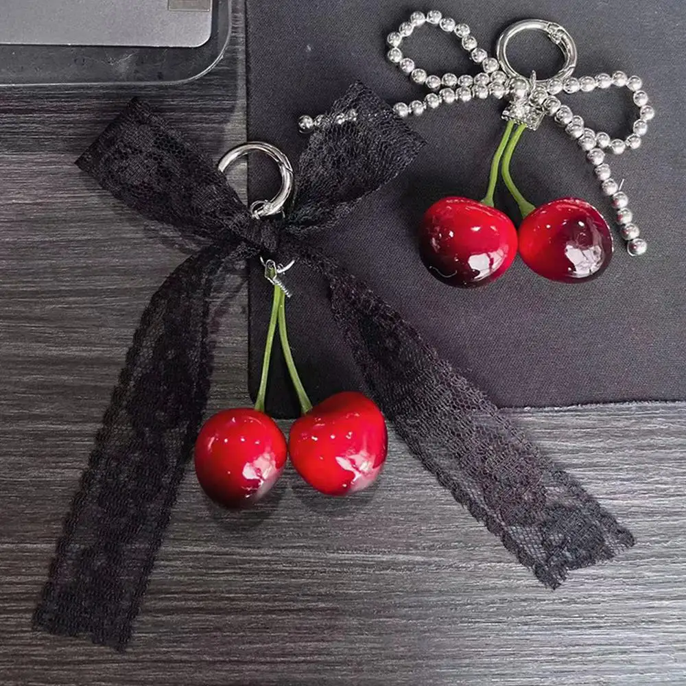 الكرز حقيبة سحر الهاتف ديكور ظهره الديكور حقيبة قلادة المفاتيح مقوس دانتيل الشريط تقليد اللؤلؤ Bowknot سلسلة مفاتيح