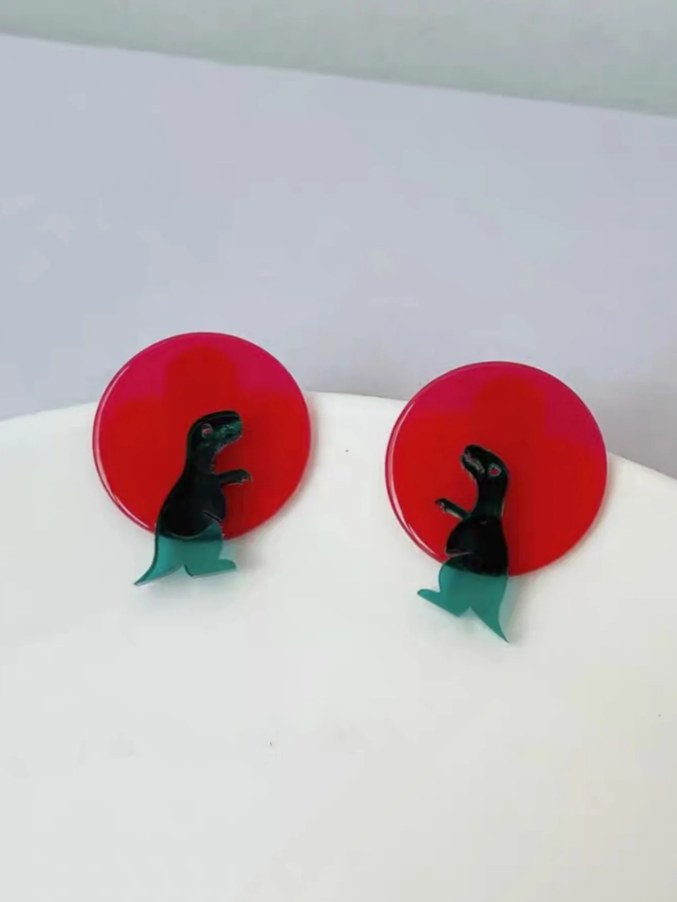 A Pair of Cute Cartoon Transparent Geometric Dinosaur Earrings in Contrasting Colors