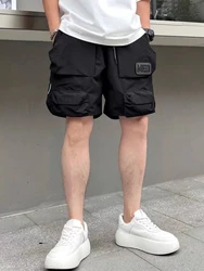 Pantaloni corti per uomo pantaloncini Cargo larghi verdi larghi da uomo Multi tasca comodi grandi e alti in Nylon Jorts abbigliamento Harajuku