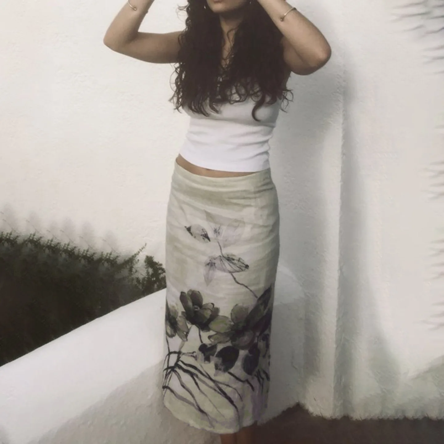 

European and American new ink retro flower print spice girl skirt summer mesh stitching low waist hip skirt long skirt.