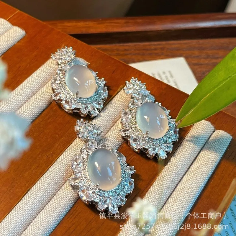 Silver-plated set with natural high-quality white chalcedony in a pigeon egg shape, including a necklace, pendant, earrings, and