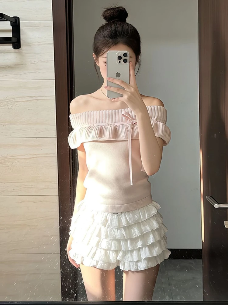 

Элегантный комплект в студенческом стиле: женский летний вязаный свитер с бантом и шнуровкой на плечах + плиссированная короткая юбка, милый комплект.