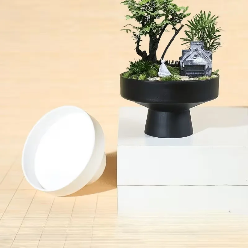 Modern Minimalist Black Flowerpot Planting Container with Wide Shallow Base And Tall Legs for Home Garden Decor