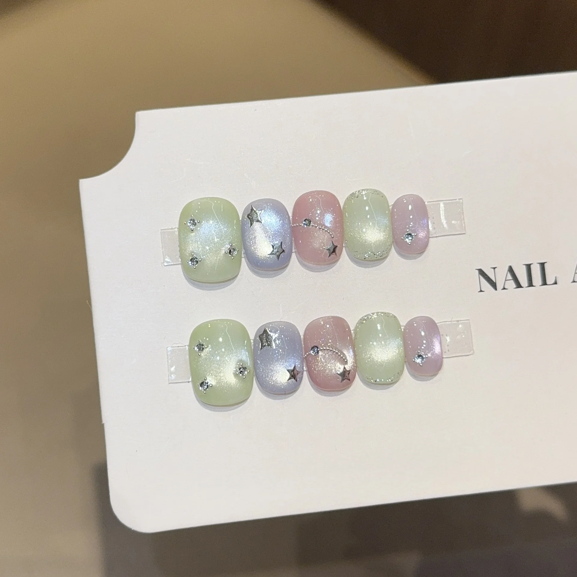 

10pcs Dreamy Pastel Cat Eye Handmade Nail Short Round False Nails with Star Rhinestone Accents&Ombre Glitter Acrylic Nail Tips
