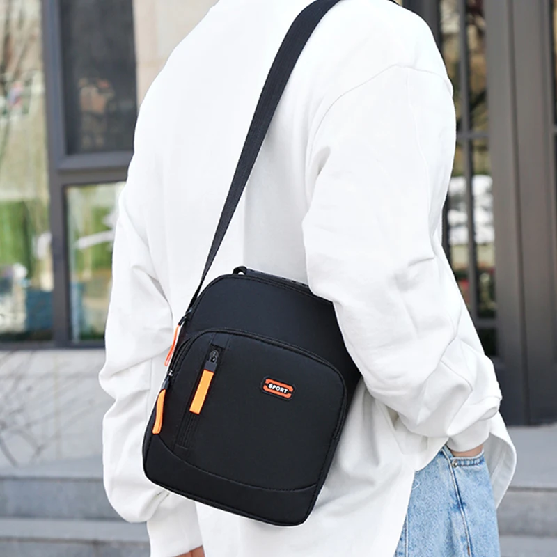 

Men's cross-body bag with double zippers and no printed pattern. Simple design, suitable for business travel.