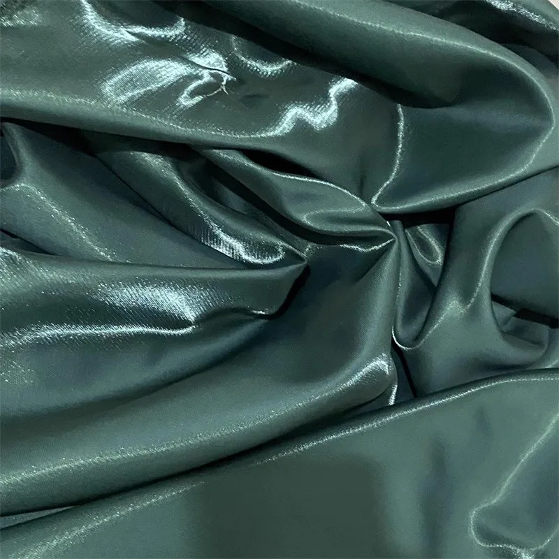 Dark green glossy metal liquid satin fabric with shiny water light satin design dresses suits and DIY sewing materials