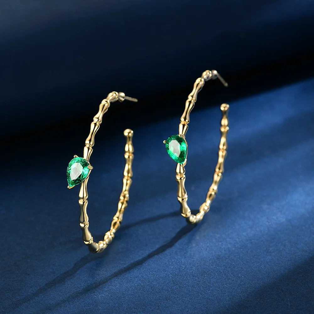 

New S925 silver inlaid 0.8ct water droplet 5 * 7 cultivated synthetic emerald design bamboo knot earrings, wedding jewelry