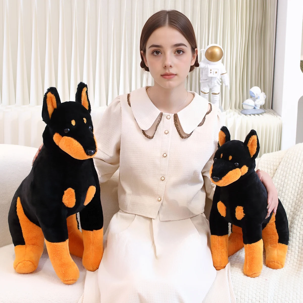 

A large, cute, soft Dachshund plush toy, a creative dog sitting posture, a Dachshund doll cushion, a birthday party gift