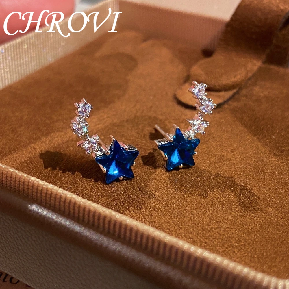 Luxury 925 sterling silver single-row curved zirconia stud earrings for women, with a fresh and light blue crystal star design.