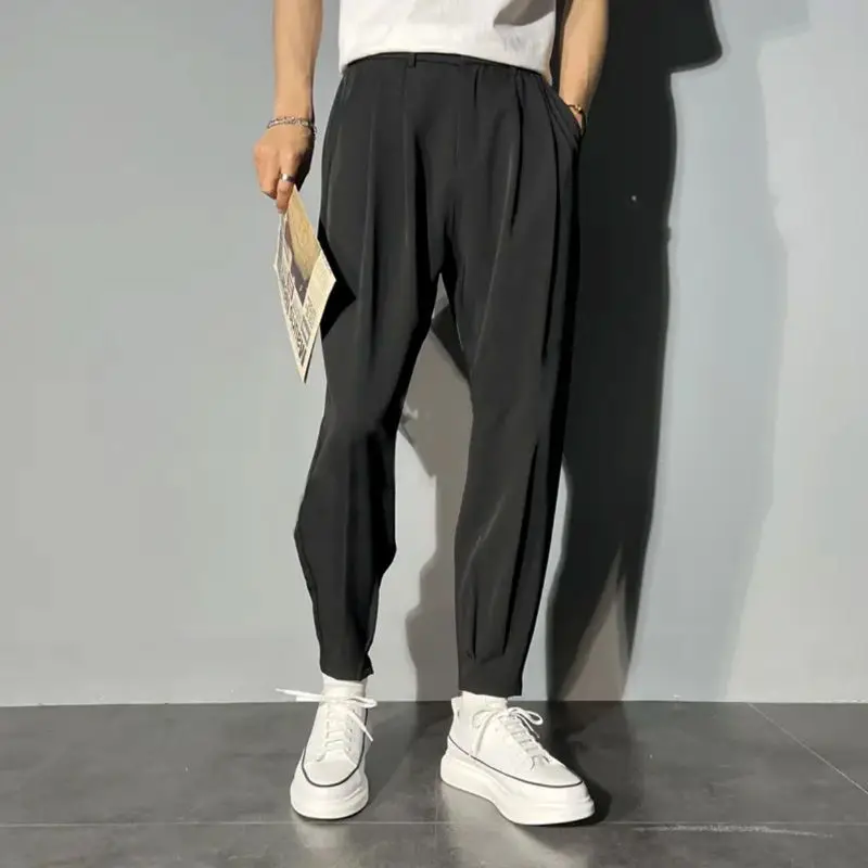 

Men's Spring and Autumn New Fashion Versatile Solid Color Pocket Zipper Elastic Split Casual Loose Feet Harlan Pants