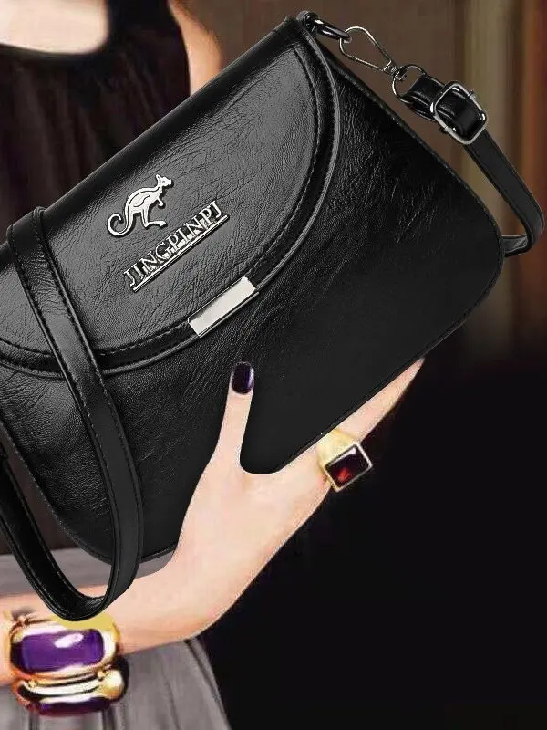 Sensação de couro bolsa feminina 2025 novo sle único oulder crossbody saco do telefone grande capaci materna saco commuter faion