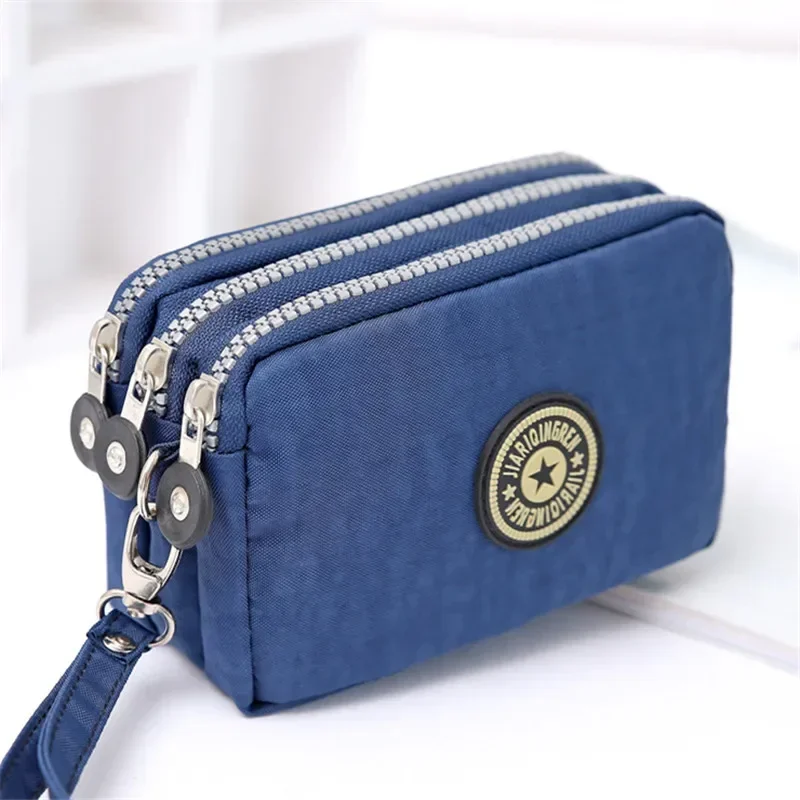 Nova bolsa de moedas com três zíperes feminina jeans lavado, bolsa de maquiagem, bolsa de telefone, bolsa portátil de mão