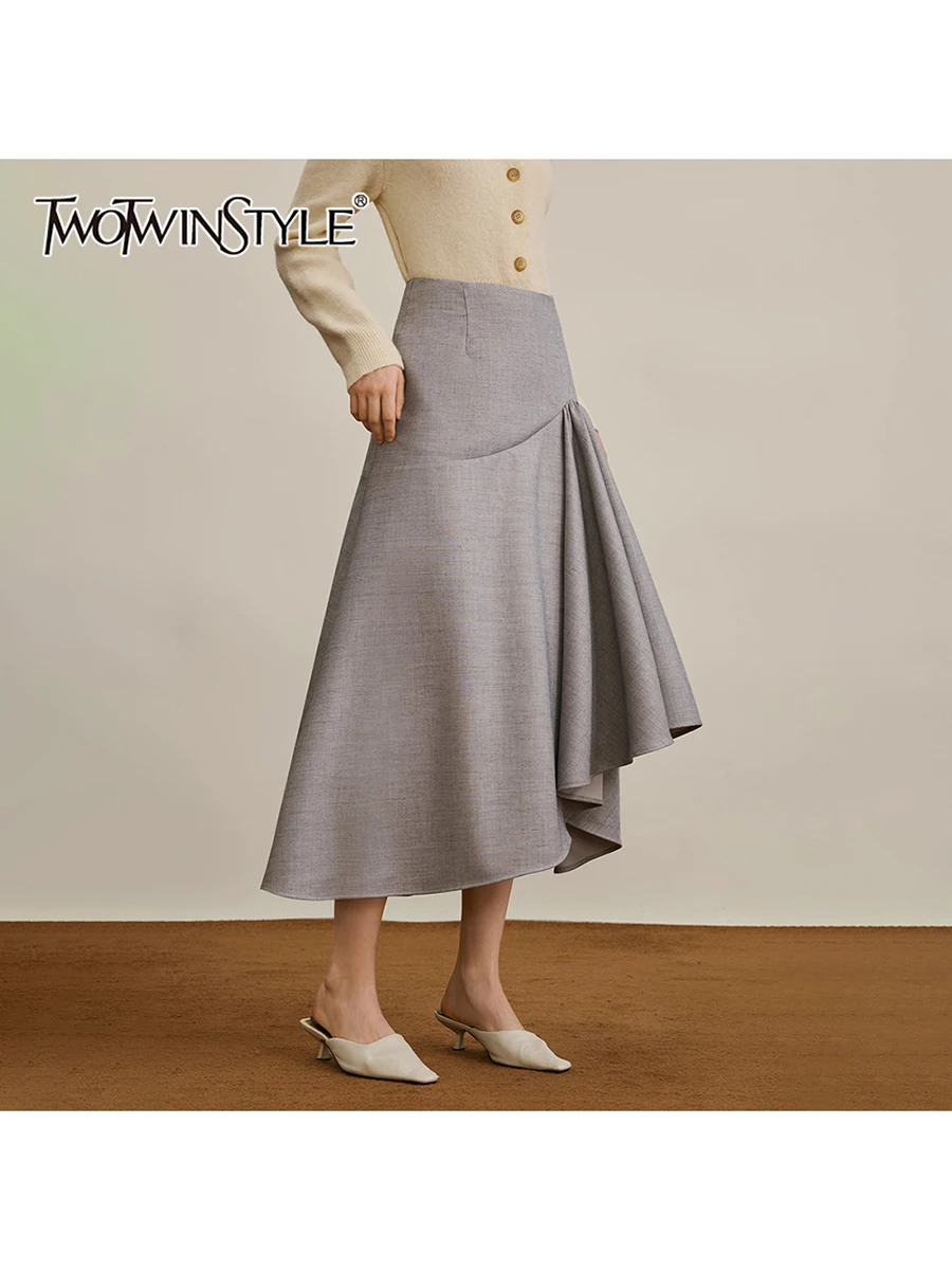 

TWOTWINSTYLE Solid Loose Spliced Folds Irregular Skirts for Women High Waist Minimalist Long Skirt Female Fashion Clothing New