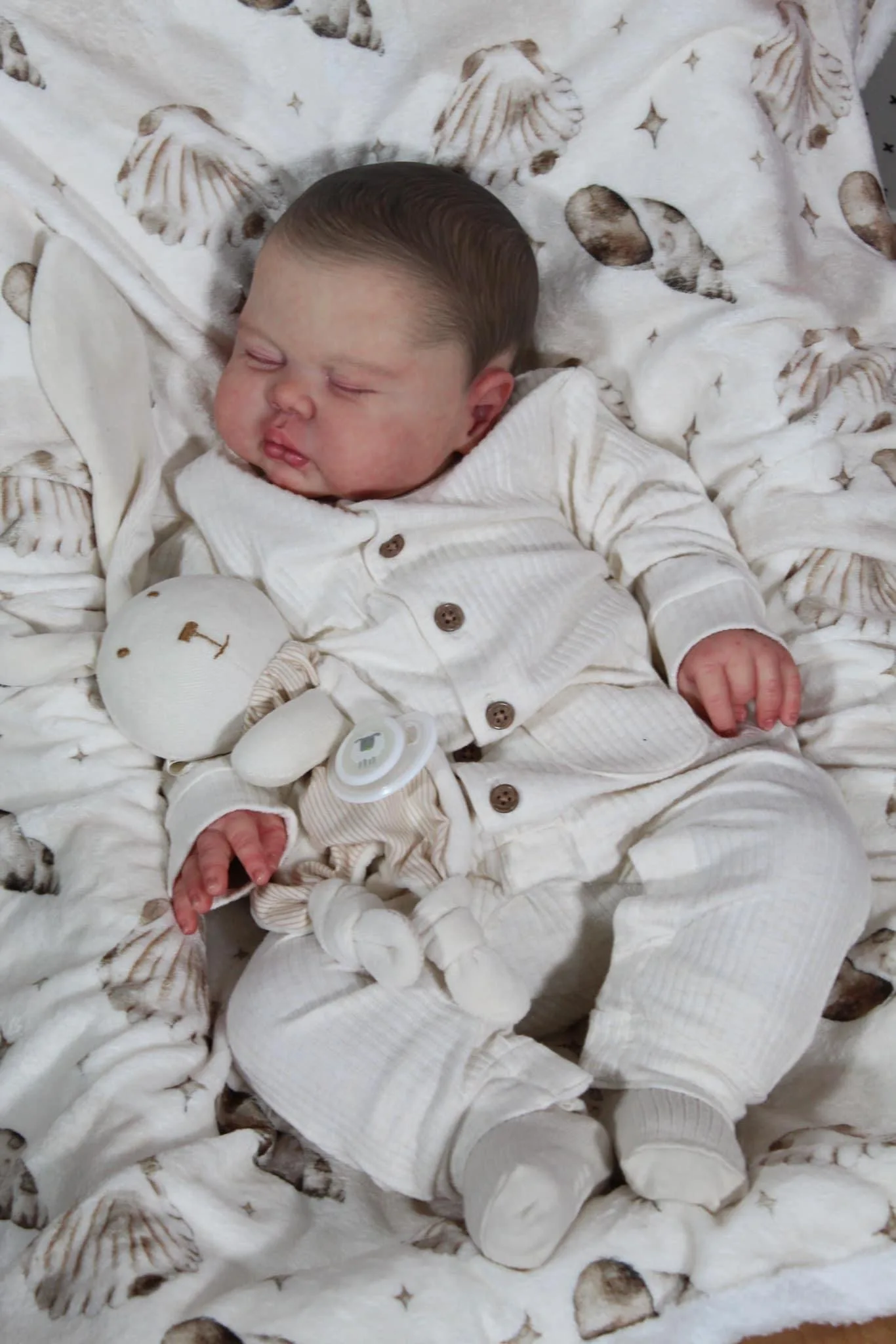 

NPK 24 Inch Lifelike Reborn Toddler Doll Cuddly Baby Boy with Hand-Painted Hair Silicone Soft Cloth Body Pickle Color