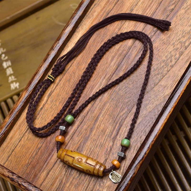 Tibetan style literature playback bone carving nine eyes dzi pendant jumper chain retro ethnic style hand-woven rope necklace
