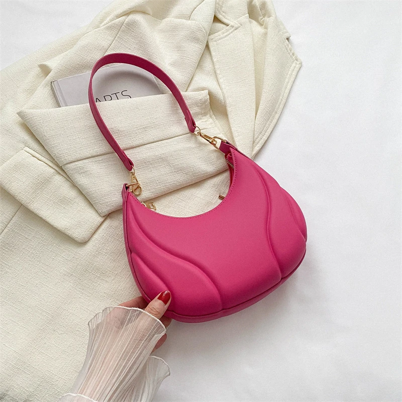 Candy colored hand-held shoulder bag