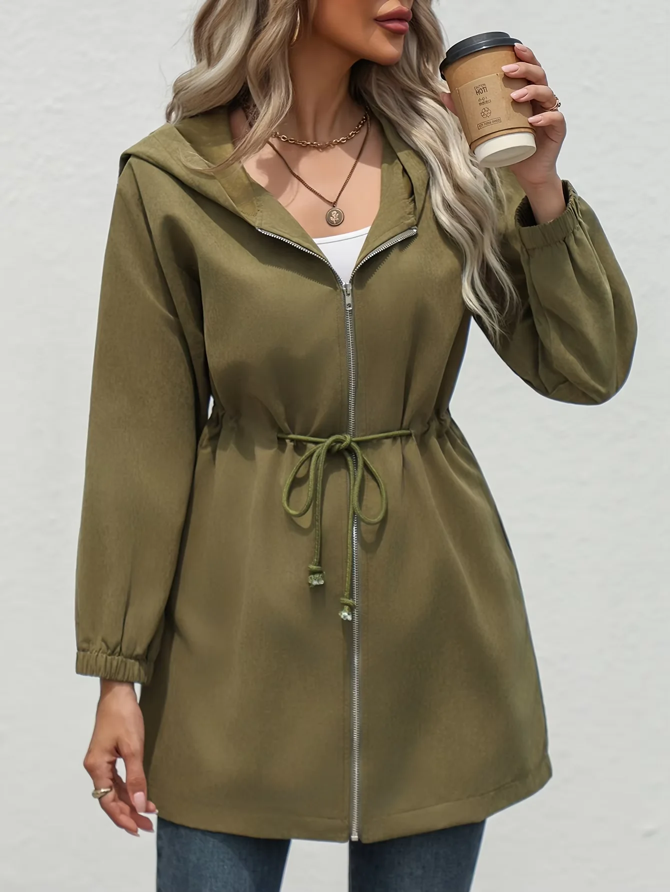 A new autumn and winter fashion mid-length jacket with a cinched waist and a hood for young girls in Europe and America