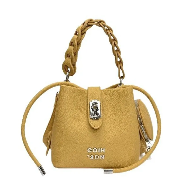 

Summer milky yellow handheld bucket bag bag female 2025 new senior sense handbag light luxury niche design Mori crossbody bags