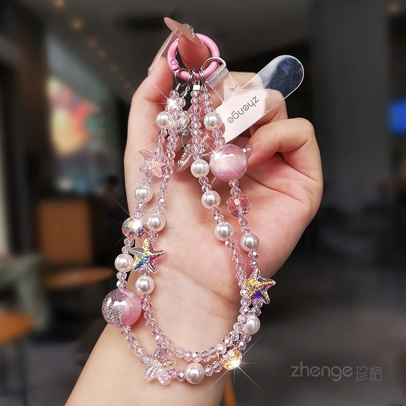 

Цепочка для телефона с жемчугом и морской звездой. Изысканный кулон премиум-класса с коротким запястьем, подвесная веревка с защитой от потерь. Новый продукт.