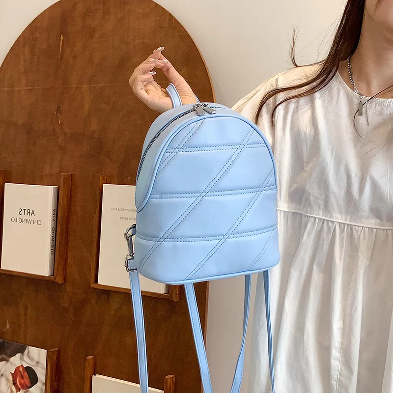 Mochila casual versátil feminina, bolsa de couro simples, grade diamante, monocromática, estudante de deslocamento, nova tendência, moda