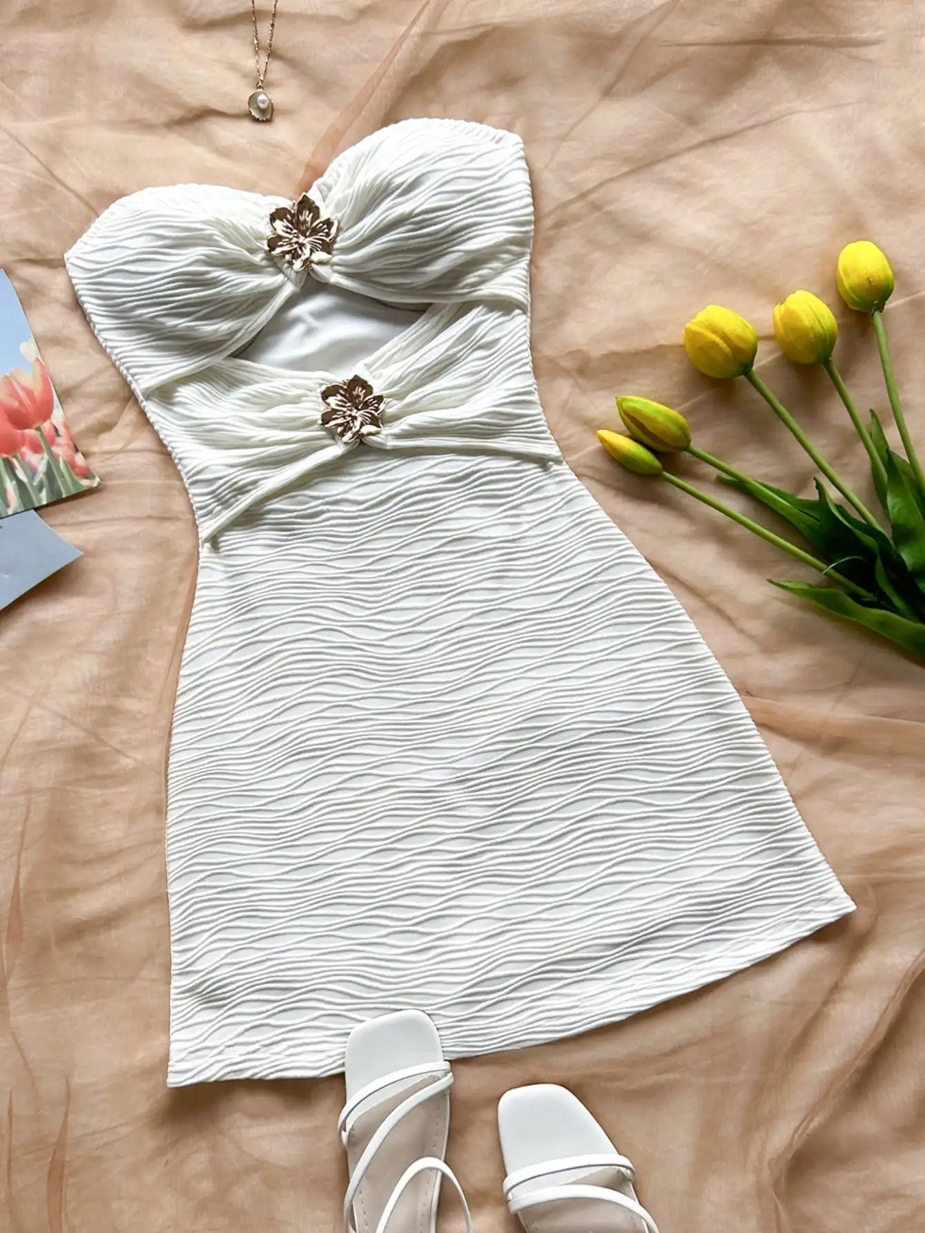 

White Strapless Ruched Mini Dress with Floral Metal Accents