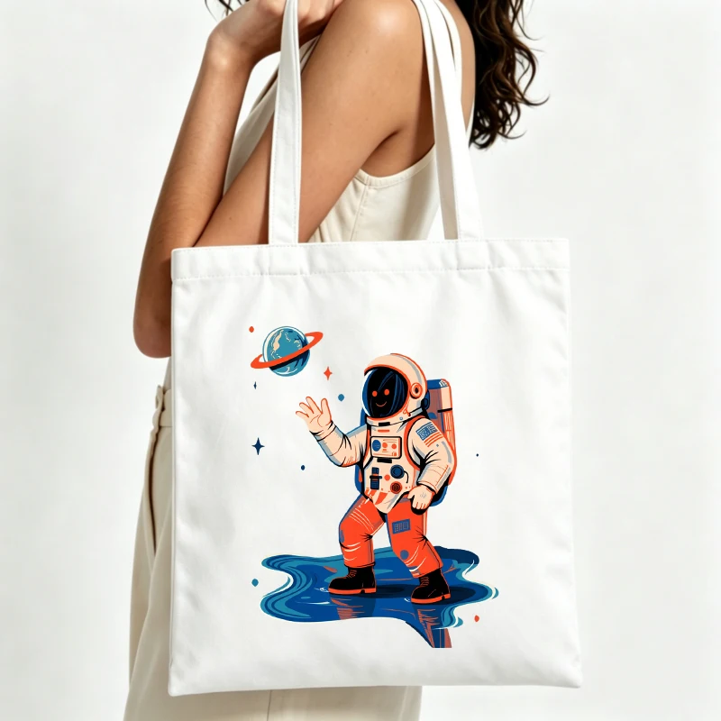 Women's astronaut graphic canvas tote bag with retro space design, ideal for casual daily use and summer outings