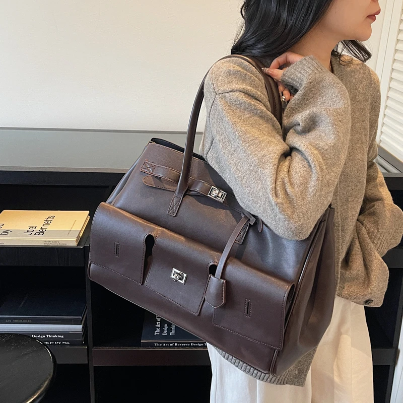 

Deconstructed Suede Tote with Floating Base Architecture and Magnetic Lock for Gallery Receptions Manifesting Sculptural Poise