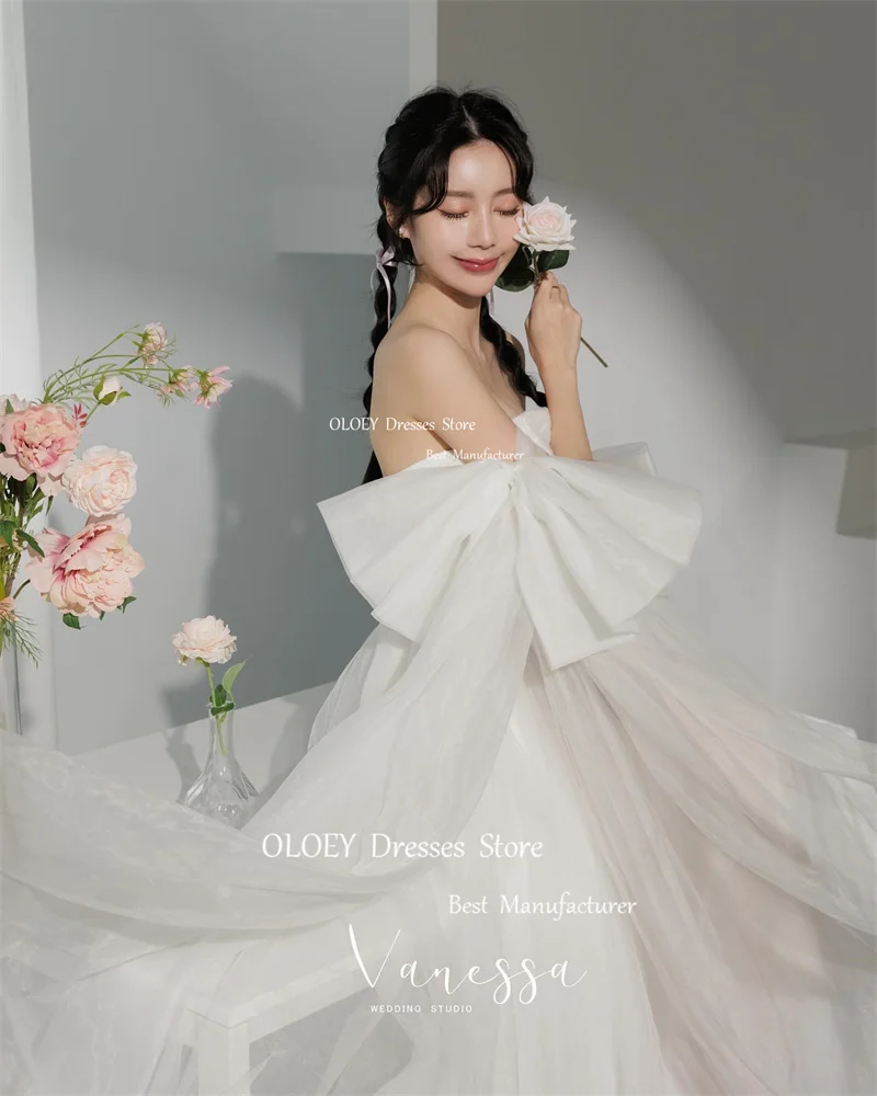 Oloey Prinzessin weichen Tüll kurze vorne lange hinten Brautkleider Korea Fotoshooting Bowknot Ärmel Brautkleider Korsett zurück