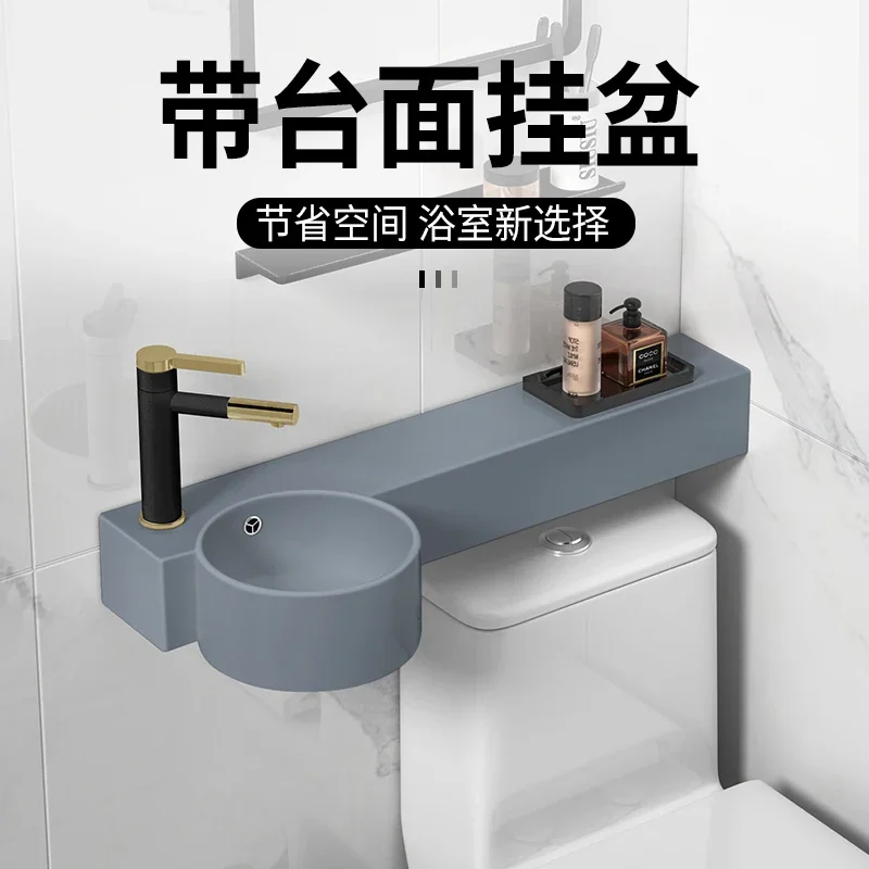 Grey integrated wall-mounted basin with countertop, narrow and long toilet, upper sink, wall corner ceramic washbasin