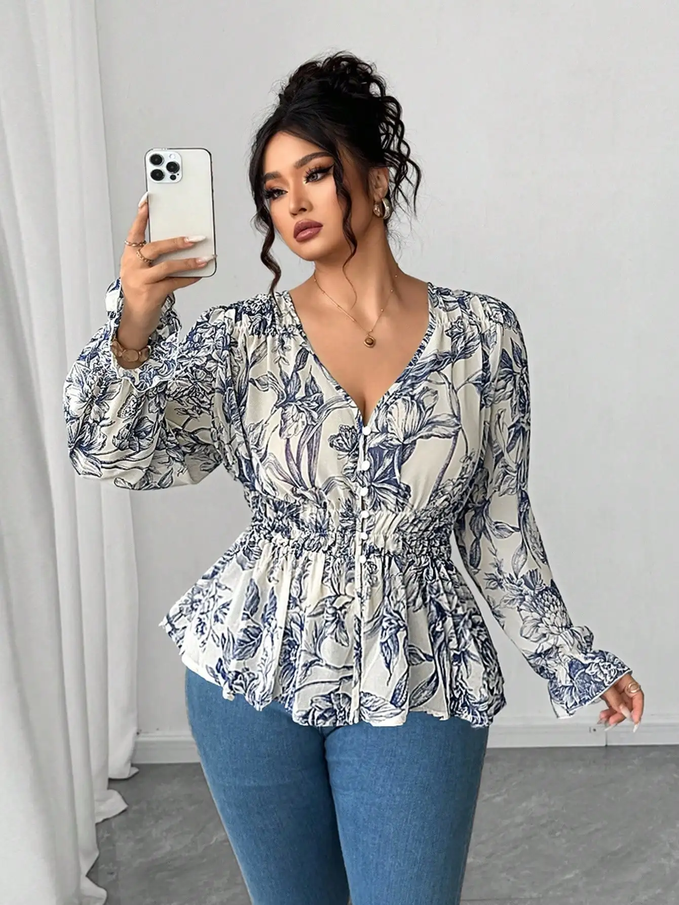 

Blue And White Floral Chiffon Blouse With Ruffle Waist And Puff Sleeves