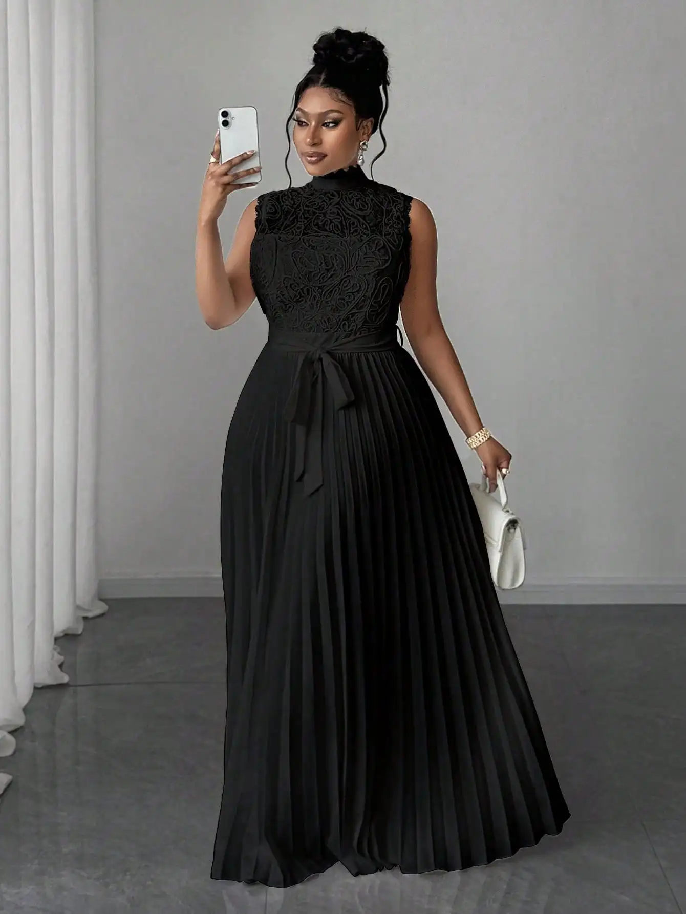 

Plus Size Elegant Black Evening Gown With High Neck Lace Bodice, Pleated Flowing Skirt And Self-Tie Waistband