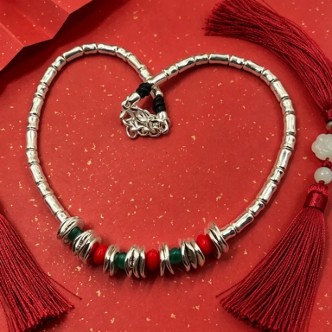 

Versatile bamboo silver bracelet with red and green beads, perfect for daily work, dating, and non collision styles