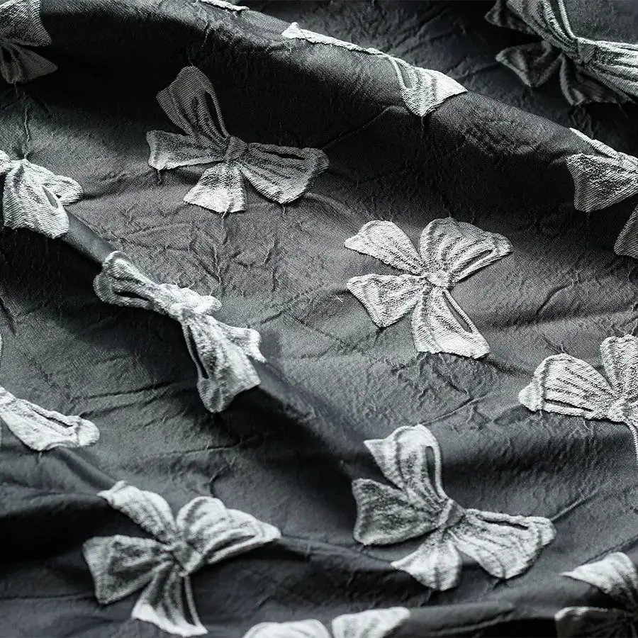 

100cmx140cm Yarn Dyed Embossed Black Bow Jacquard Fabric Stiff Polyester Autumn and Winter Jacquard Dress Fabric