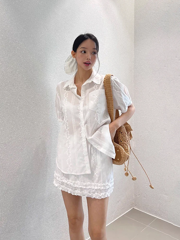 Liangliang デザインヘビー刺繍レースシャツ女性の夏の新スタイル小規模オーディエンススプライシングレースハーフスカート 2 点セット