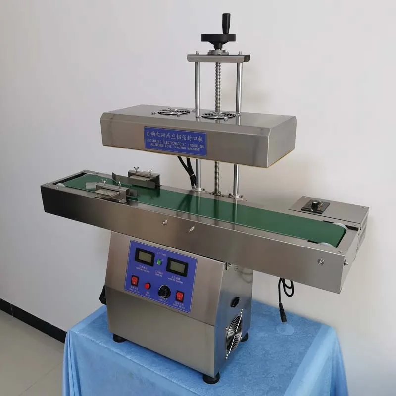 

Honey Bottle Continuous Heat Sealing Aluminum Foil Sealing Machine 2400W Snack Potato Chip Can Induction Sealing Machine