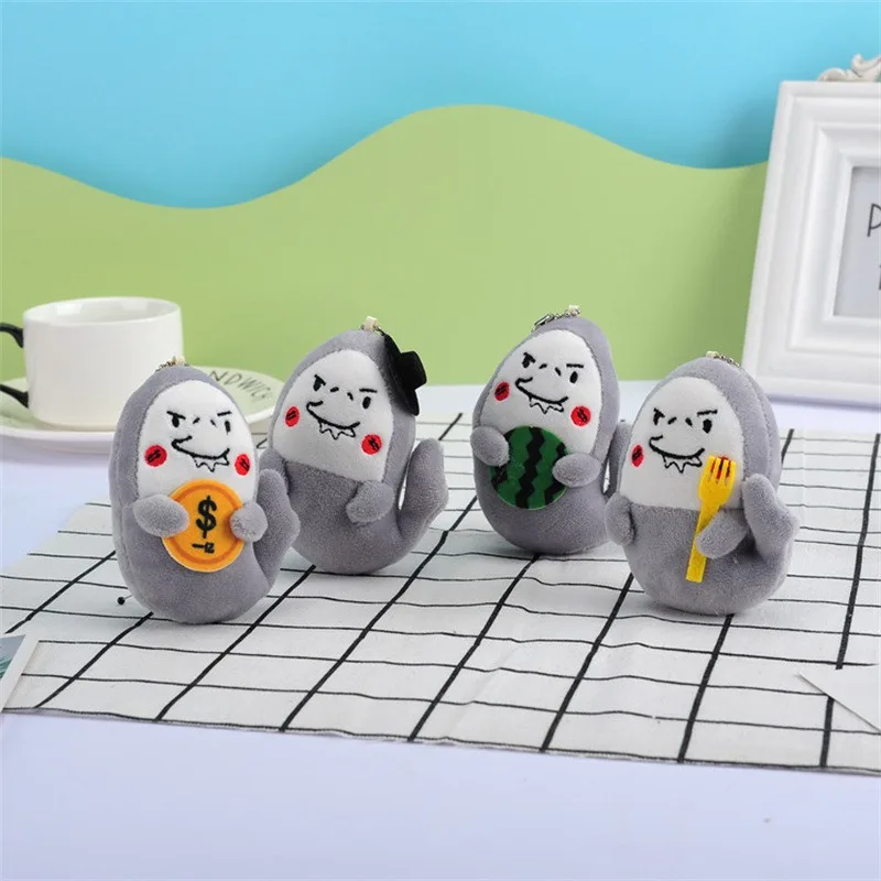 10 Cm tiburón sosteniendo dinero mochila de felpa colgante novedoso llavero de coche colgante de equipaje de dibujos animados de felpa muñeca divertida regalo de mano