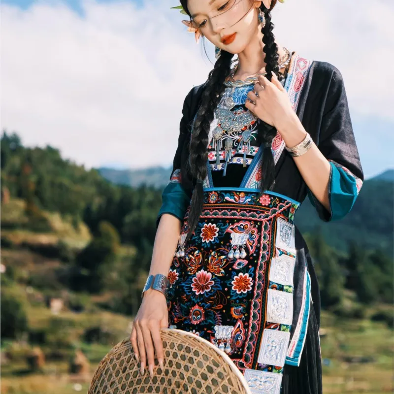 

Traditional women's pleated long dress exotic performance costume and rural Dong photography