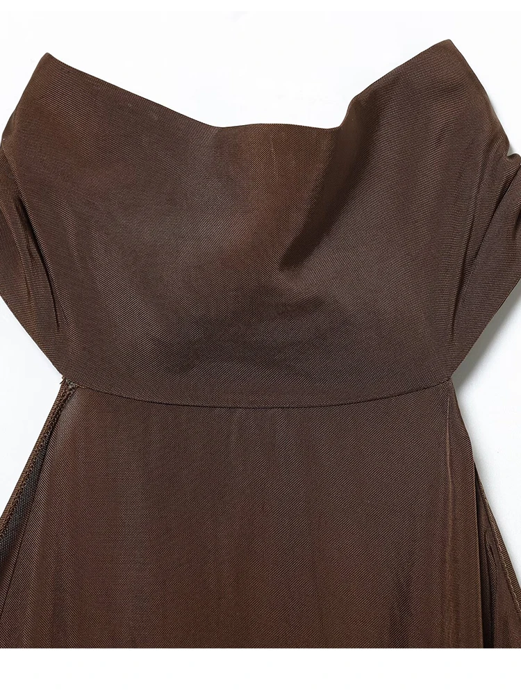 Damski top typu halter 2025, nowa moda damska, jednolity kolor, bez pleców, bez rękawów, asymetryczny dół, seksowny i elegancki top typu halter.