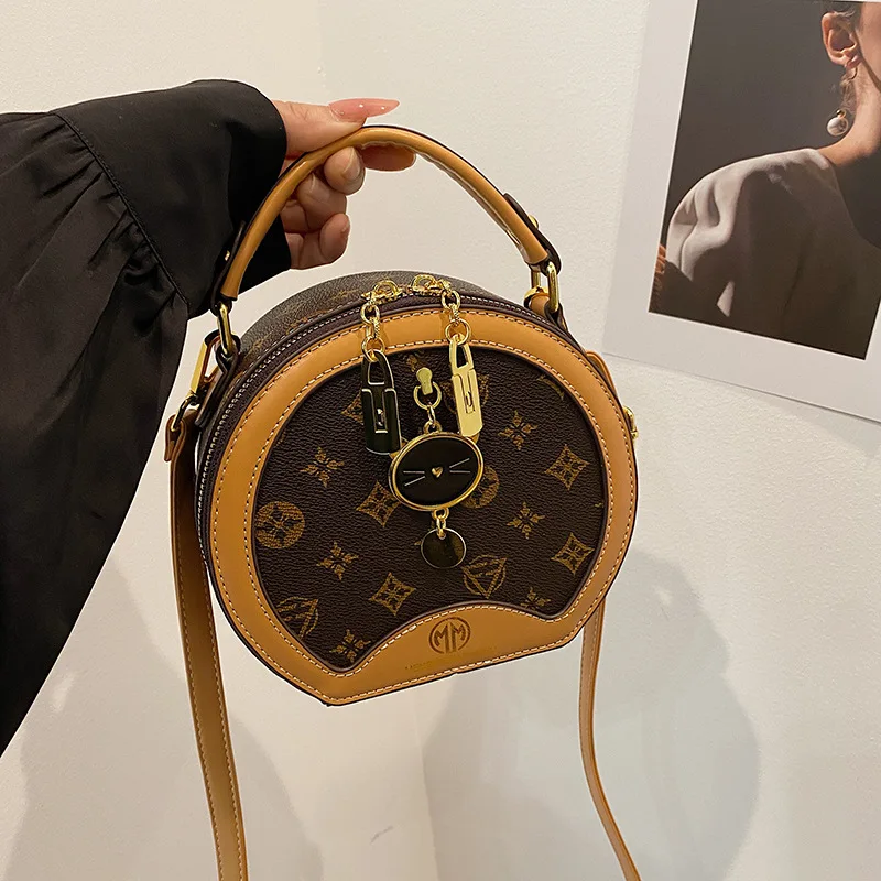 

Круглая сумка для женщин 2025 года. Дизайнерская круглая сумочка. Многосторонняя сумка через плечо с верхней ручкой.