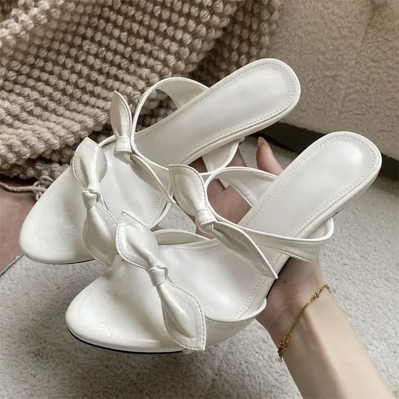 

Женские модные туфли Aneikeh: розовые мюли с бантом, на высоком тонком каблуке, с открытым носком, из лакированной кожи, для летних вечеринок и торжественных мероприятий.