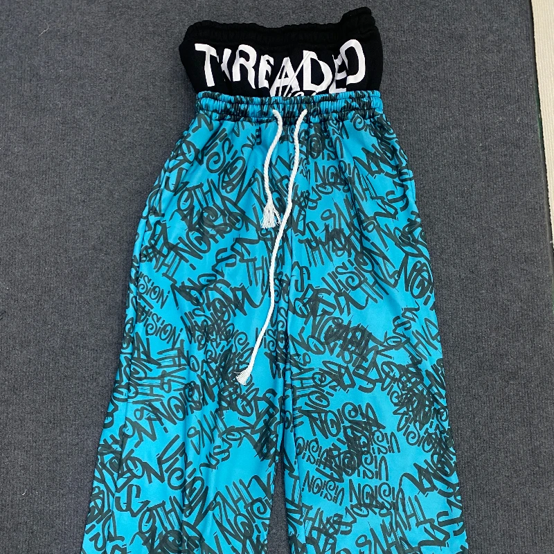 Los Pantalones anchos de doble cintura están de moda, vanguardistas, superpersonalizados y falsos de dos piezas con patrón fluorescente