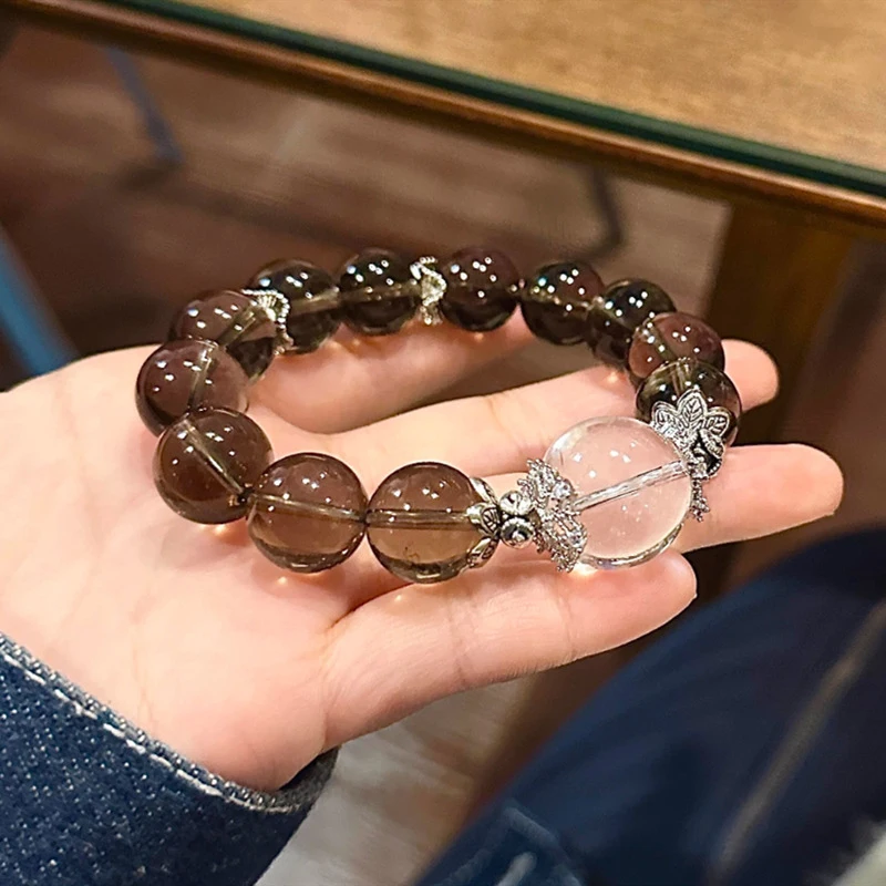 

Браслет из натурального чайного камня 12 мм с одной петлей и крупными белыми бусинами, подходит как мужчинам, так и женщинам.