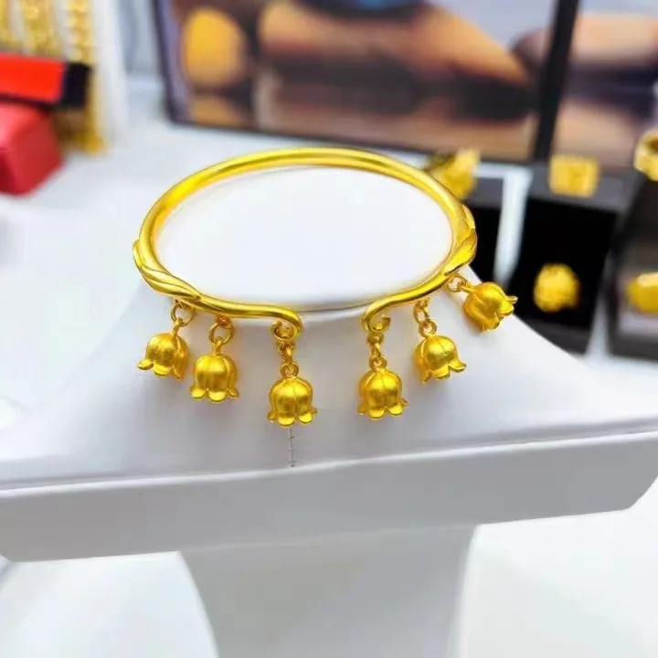 

Women's 24K Gold Lily of the Valley Bracelet | Diamond - encrusted flowers, enamel edges, ergonomic fit, tender & fresh