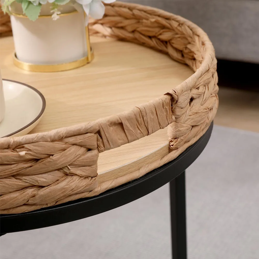 Close-up detail of hand-woven rattan tray rim and black metal base